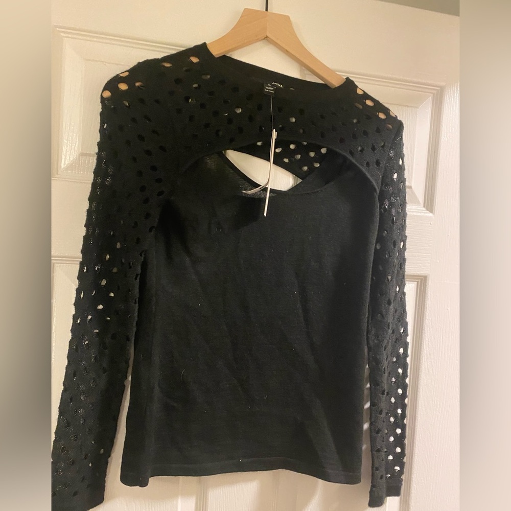 Aqua cut out crew neck top with long sleeves .